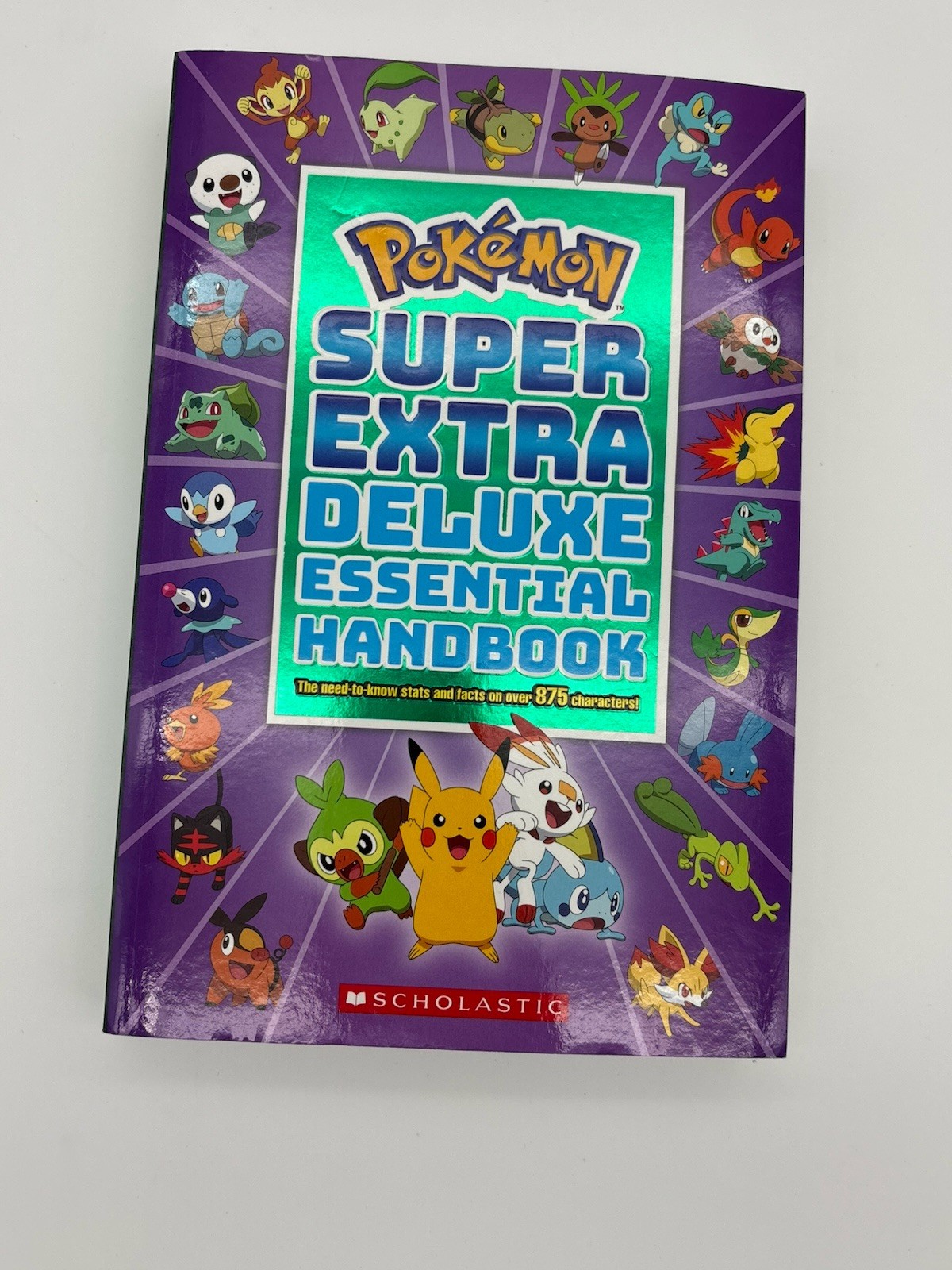 Super Extra Deluxe Essential Handbook: the Need-To-Know Stats and Facts on over